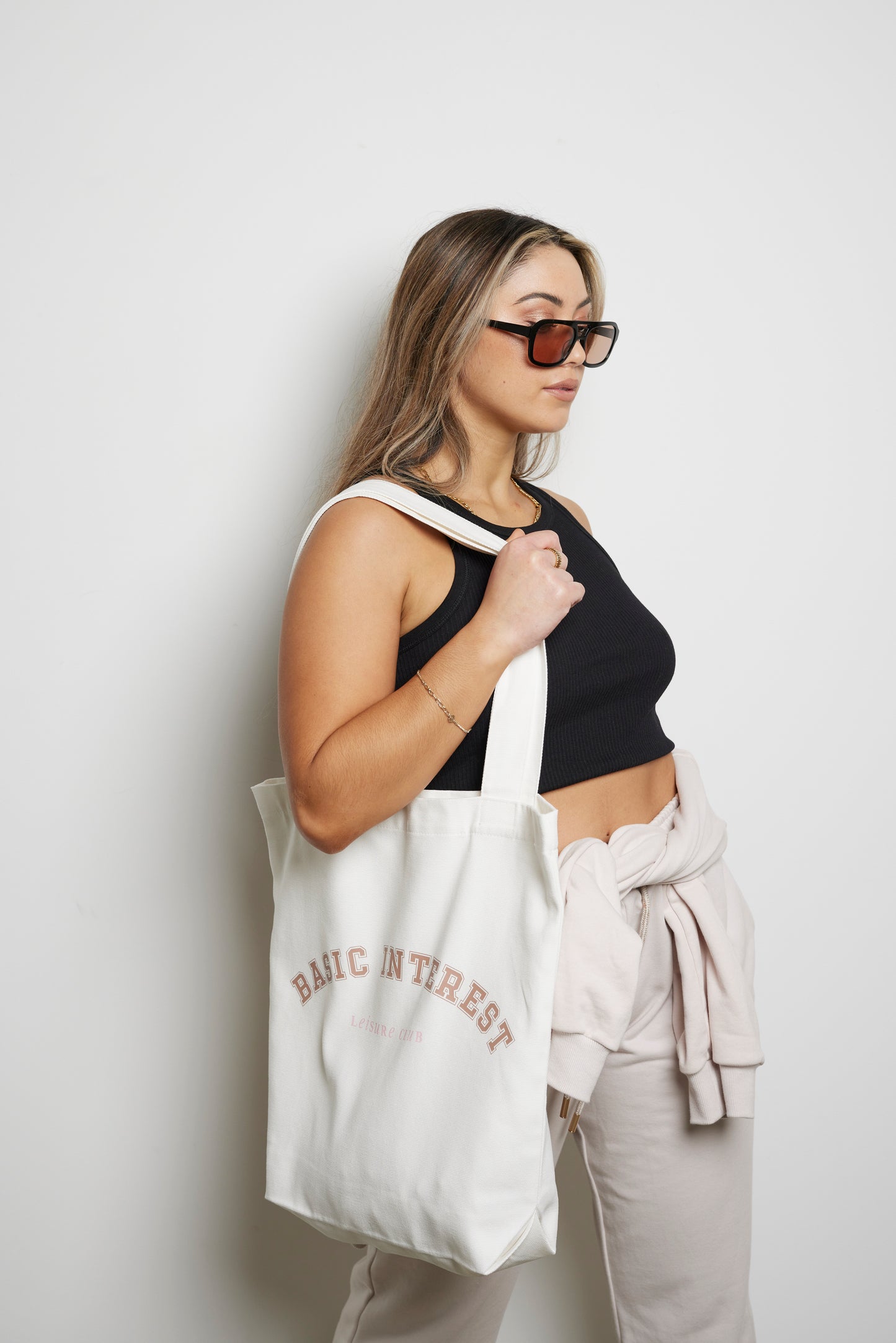 Cream tote bag with BASIC INTEREST LEISURE CLUB print