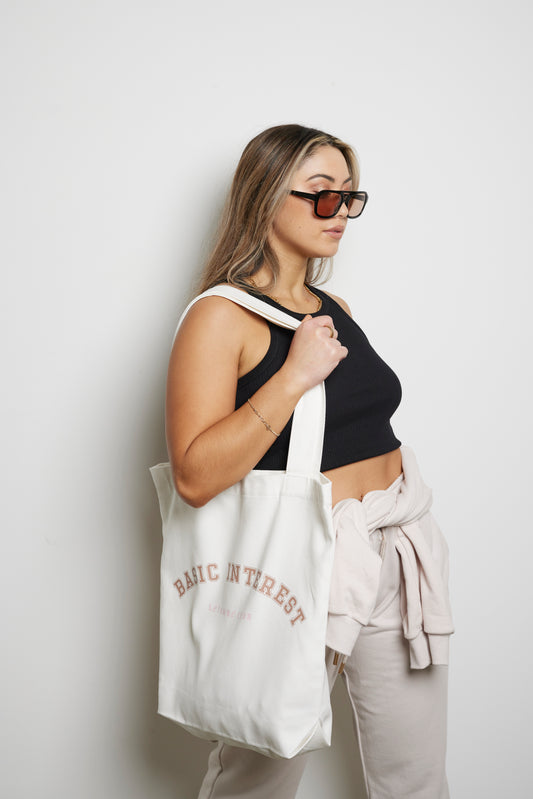 Cream tote bag with BASIC INTEREST LEISURE CLUB print